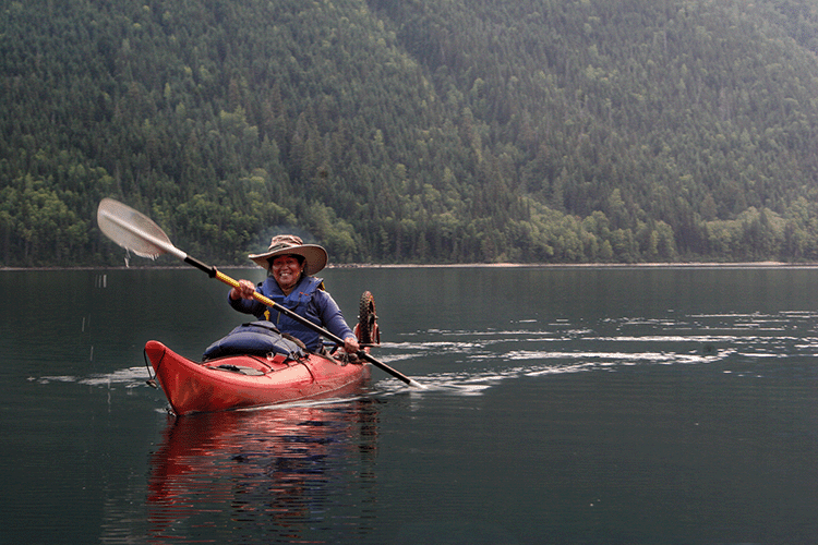 Indigenous Woman kayaking