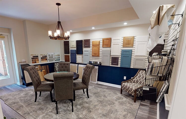 Design Center with sample kitchen cabinet doors on wall and fabrric swatches