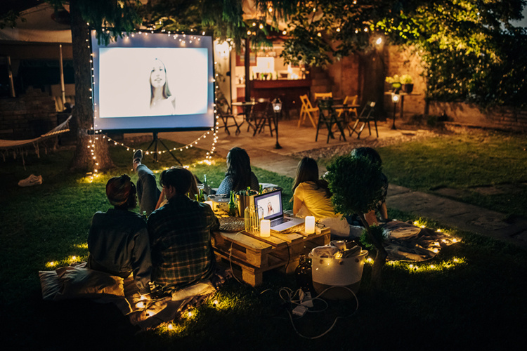Group of people at backyard movie