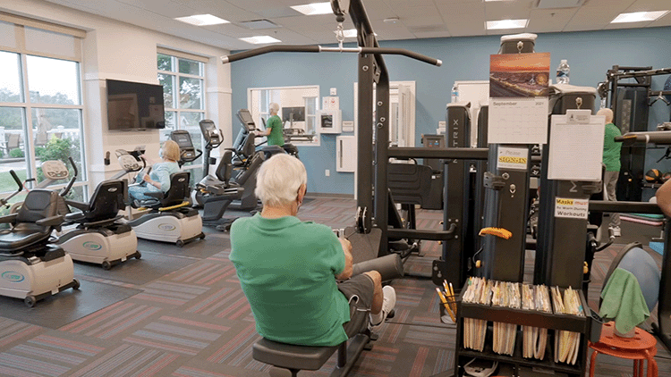 Senior Fitness center with people working on machines