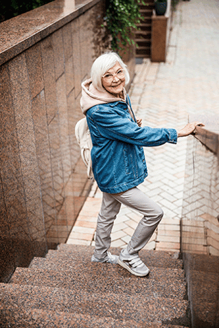 Senior Woman Walking down stairs