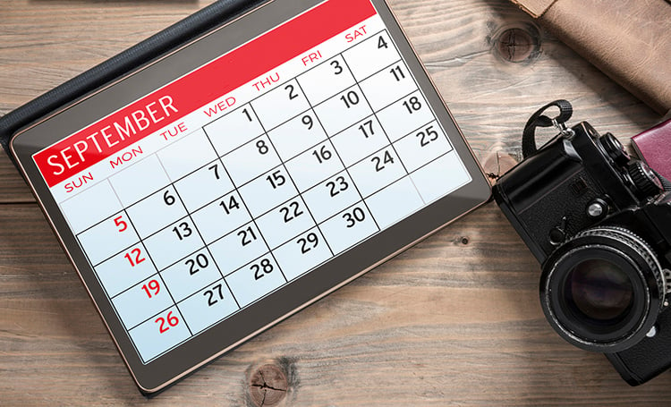 Calendar on September and a digital SLR camera